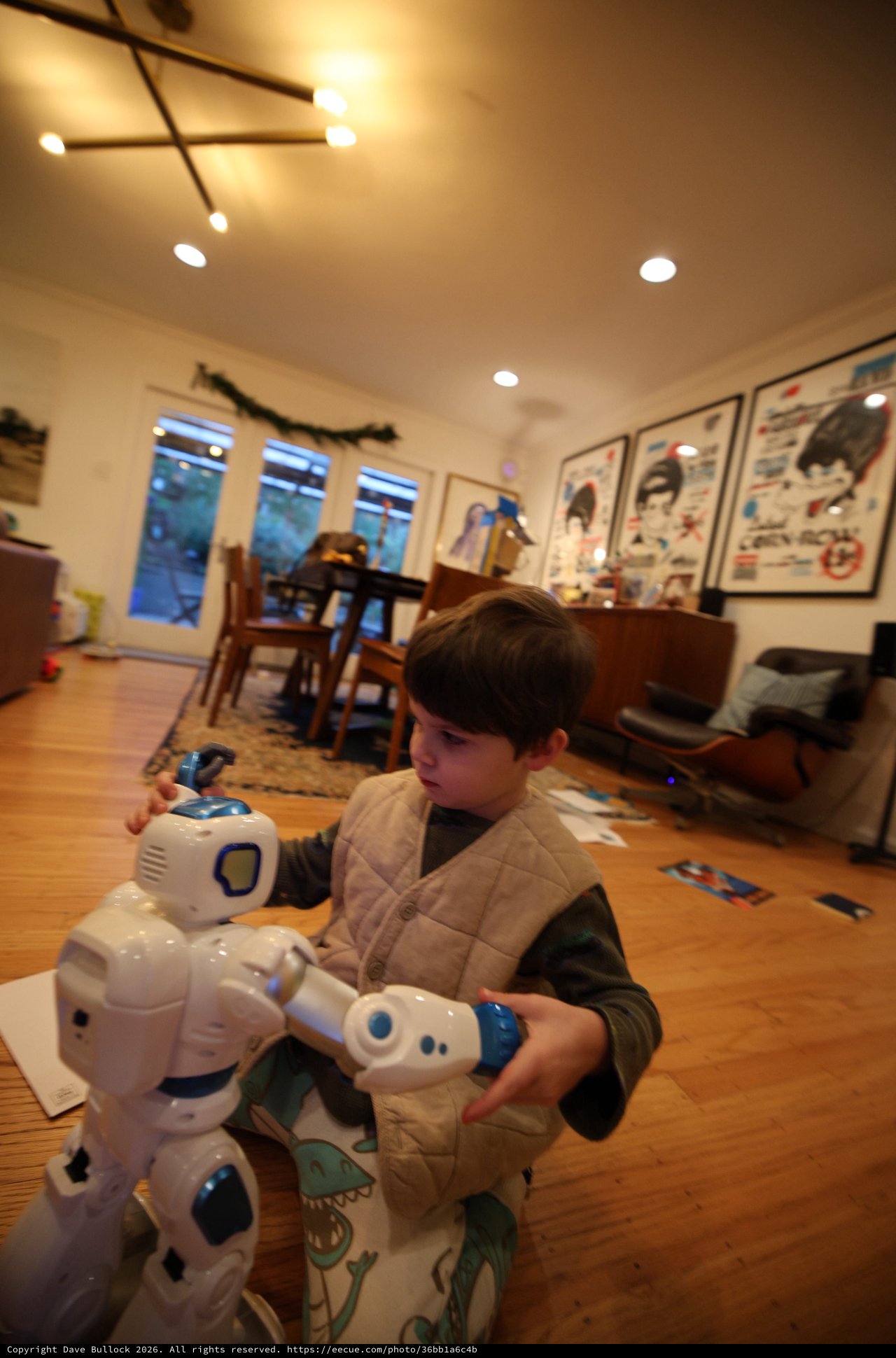 Child Playing with Robot Toy in Cozy Living Room