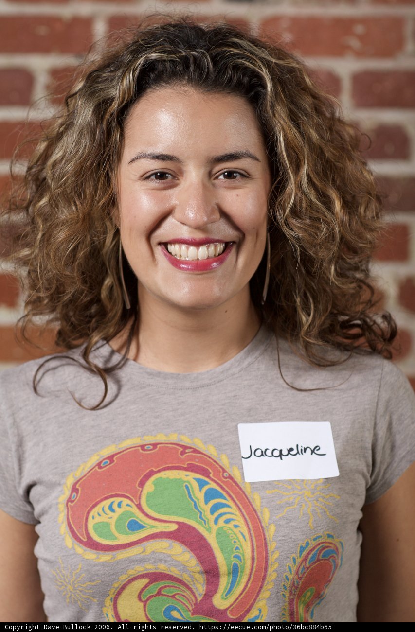 Curly-haired Woman in Patterned T-Shirt