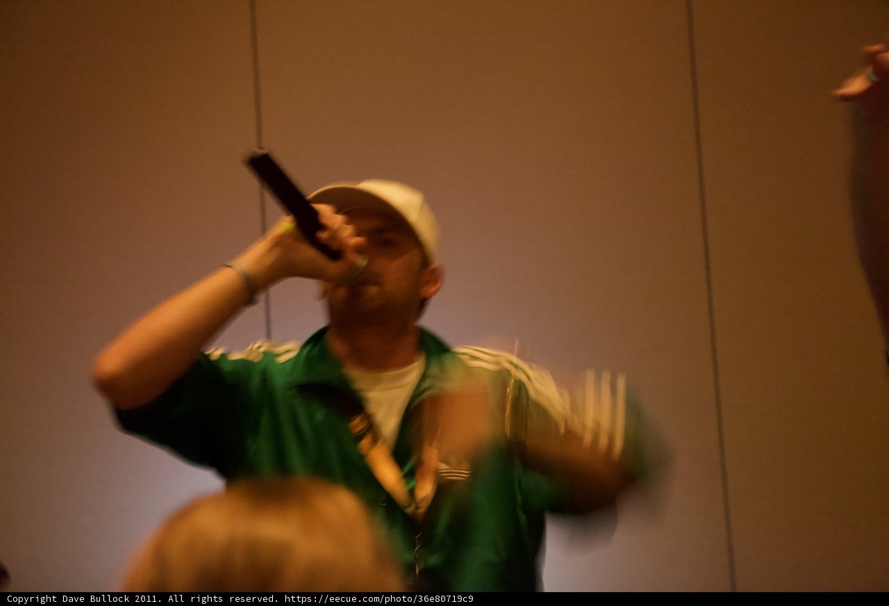 Green-Shirted Man on the Mic