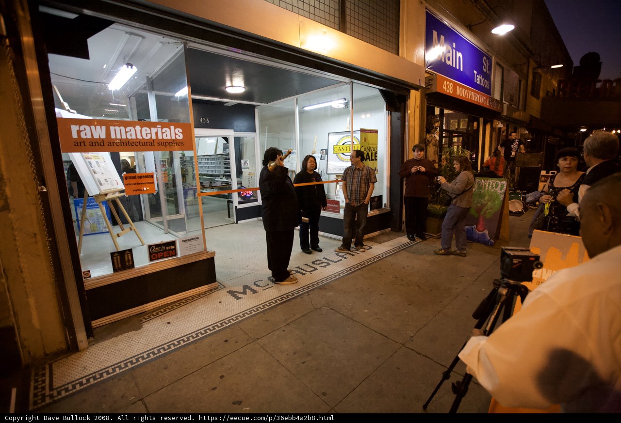 Nighttime Gathering Outside of Storefront