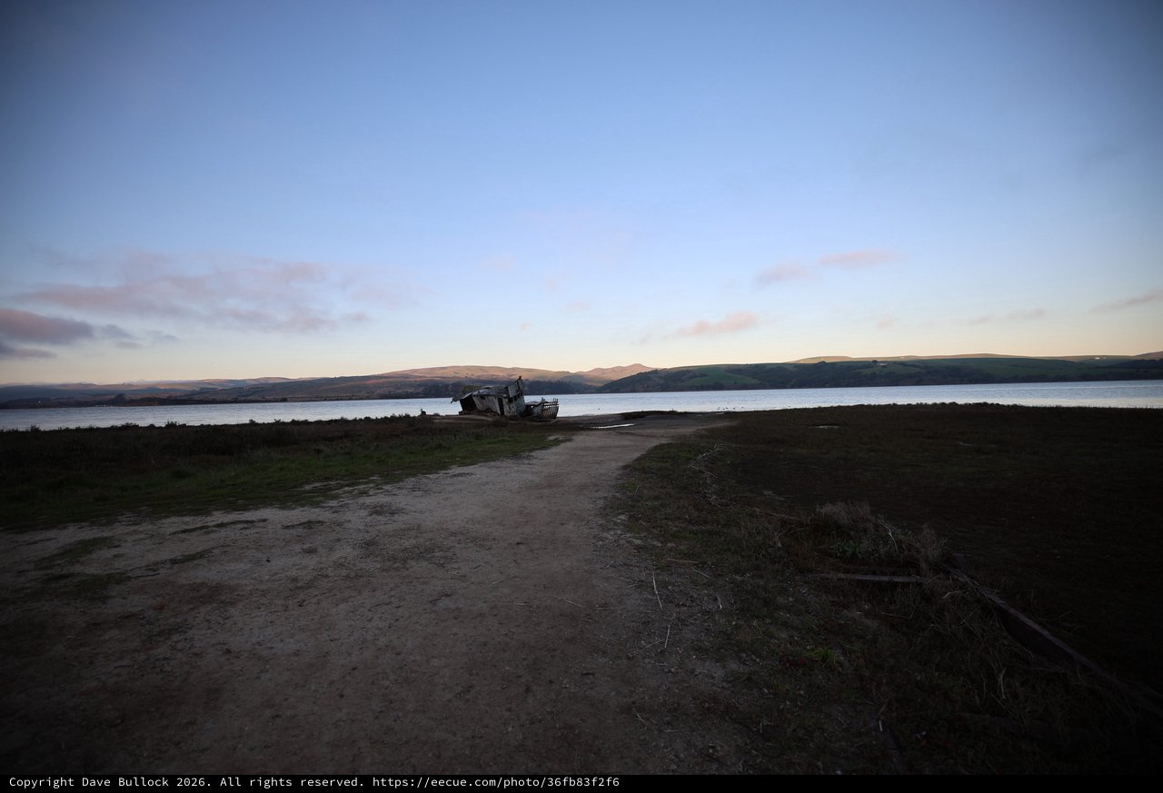 Shipwreck at Twilight on Coastal Bay