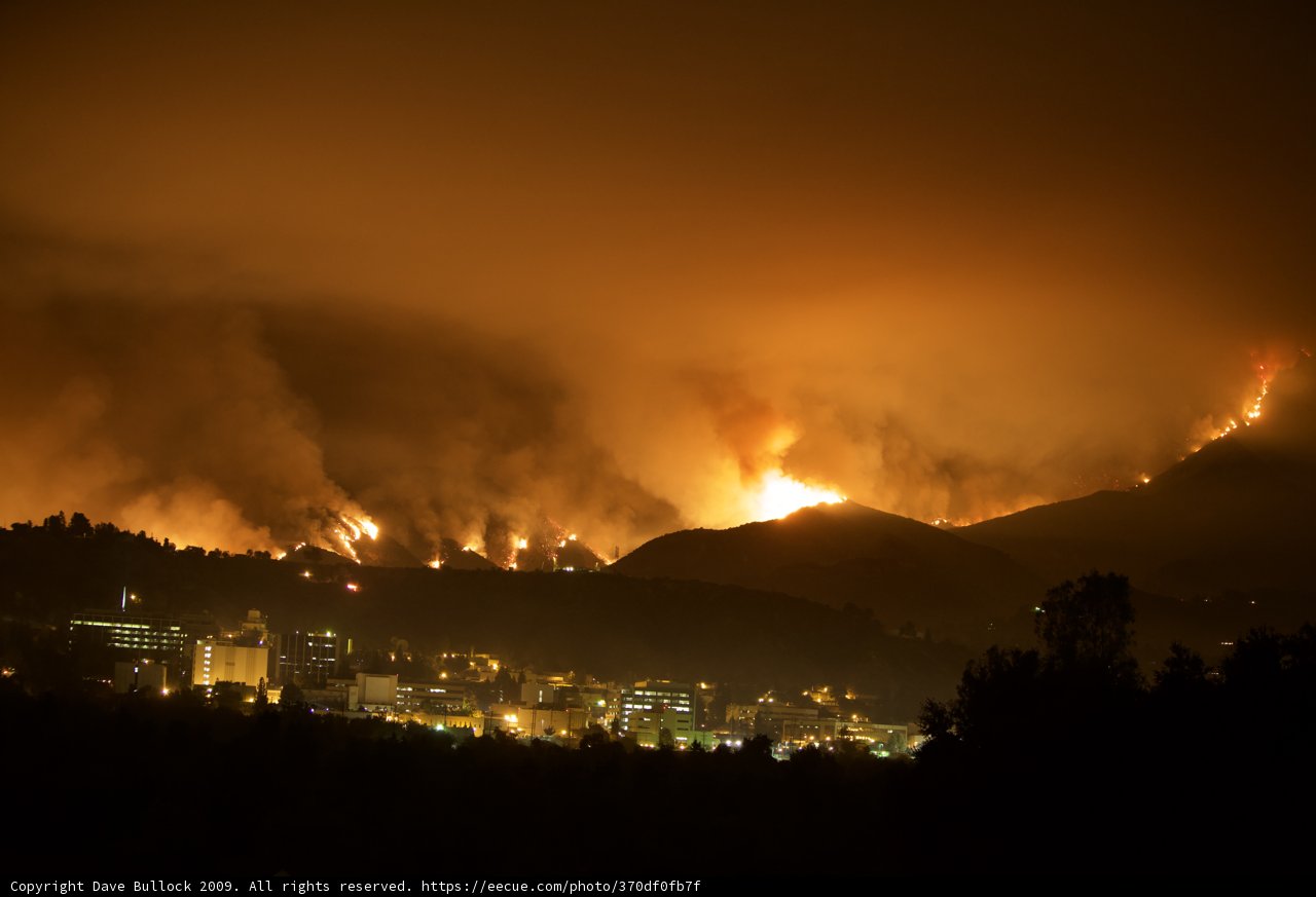Flames Ravage Hills Above City