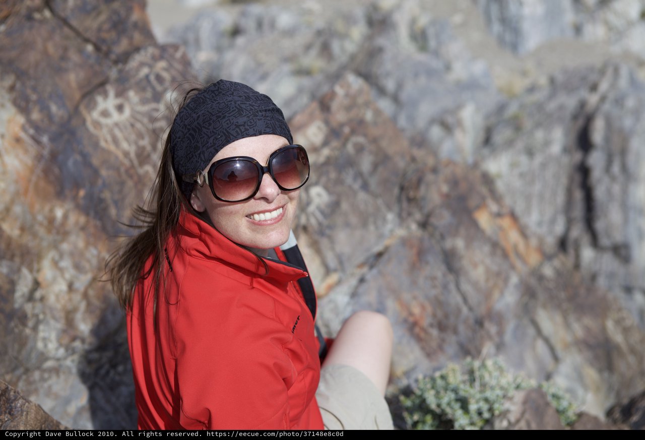 Smiling Hiker Pauses on Rocky Desert Trail