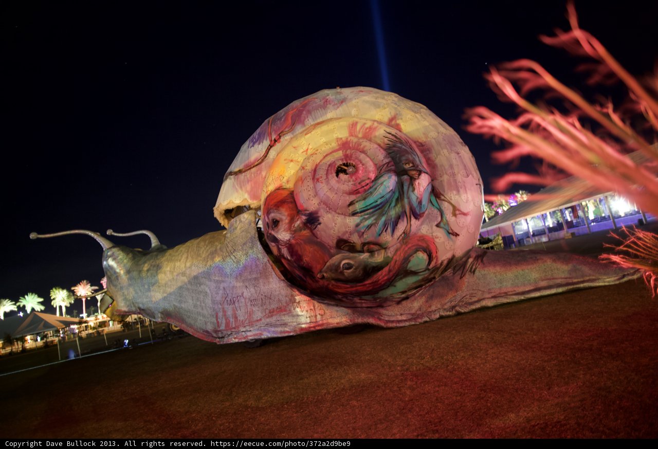Illuminated Snail Sculpture at Night