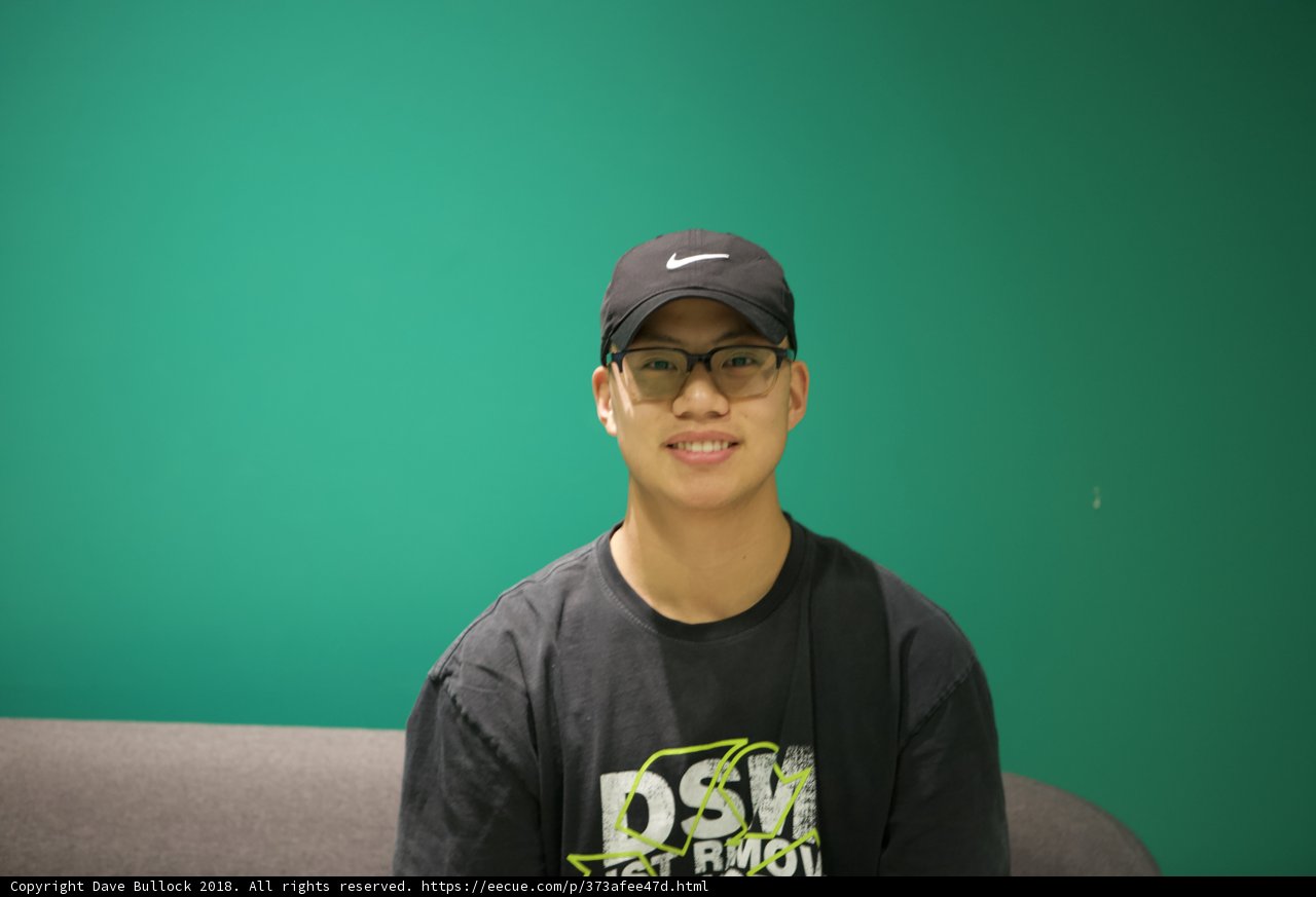 Smiling Teen in Baseball Cap