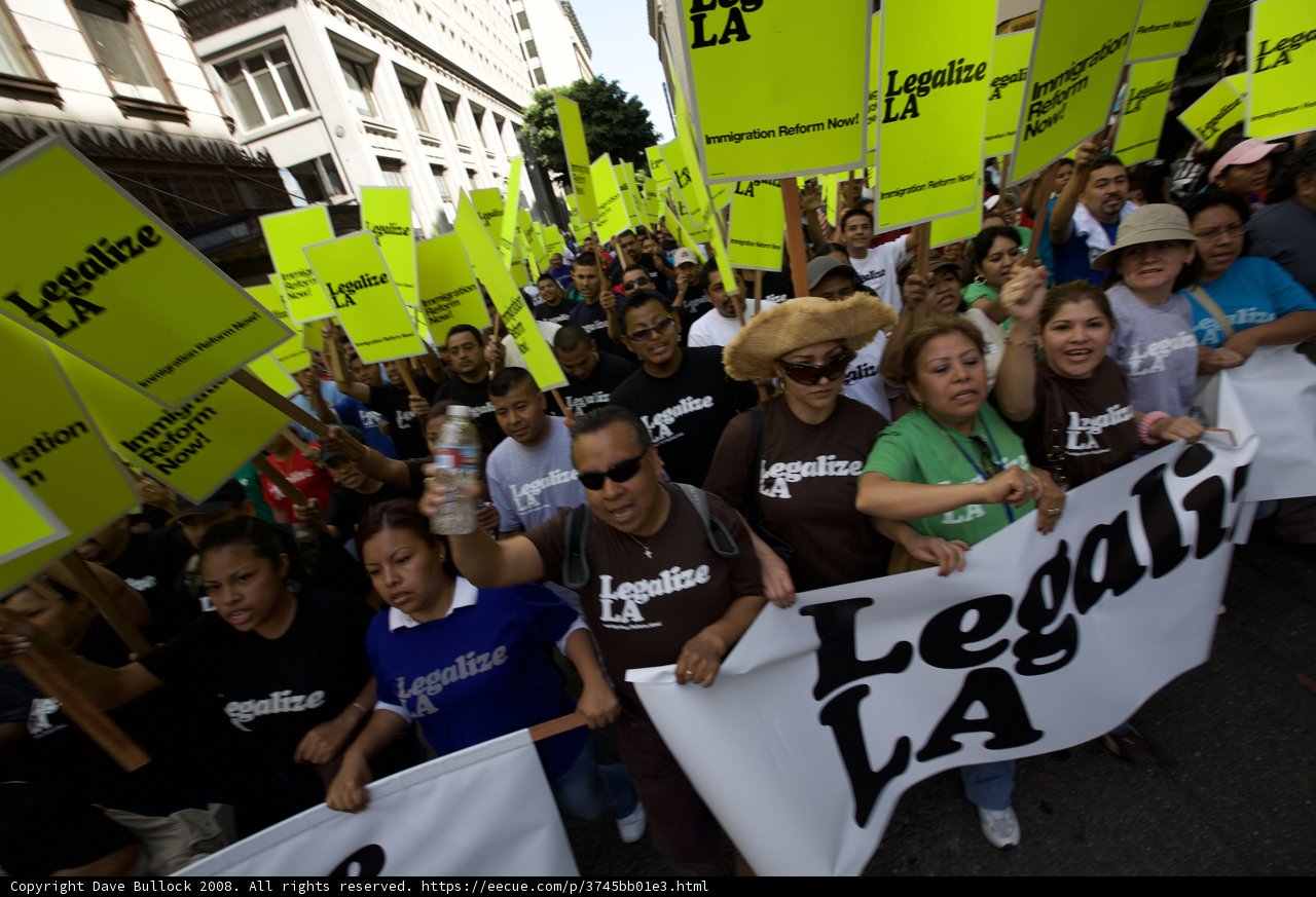 Mayday Protesters Hold Up Yellow Signs