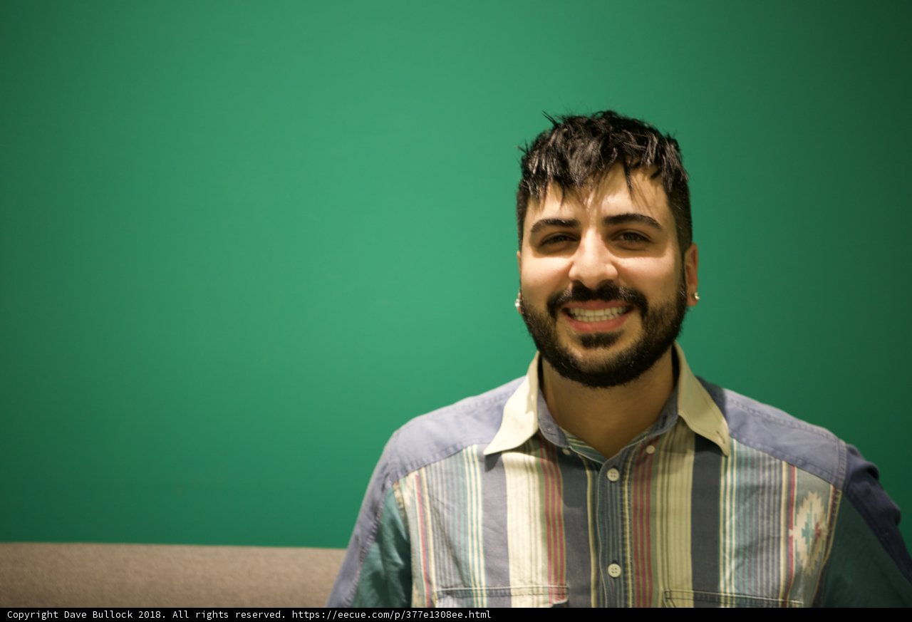 A Happy Man with a Beard and Striped Shirt