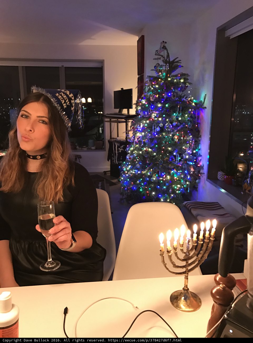Holiday Cheers in Front of the Sparkling Tree
