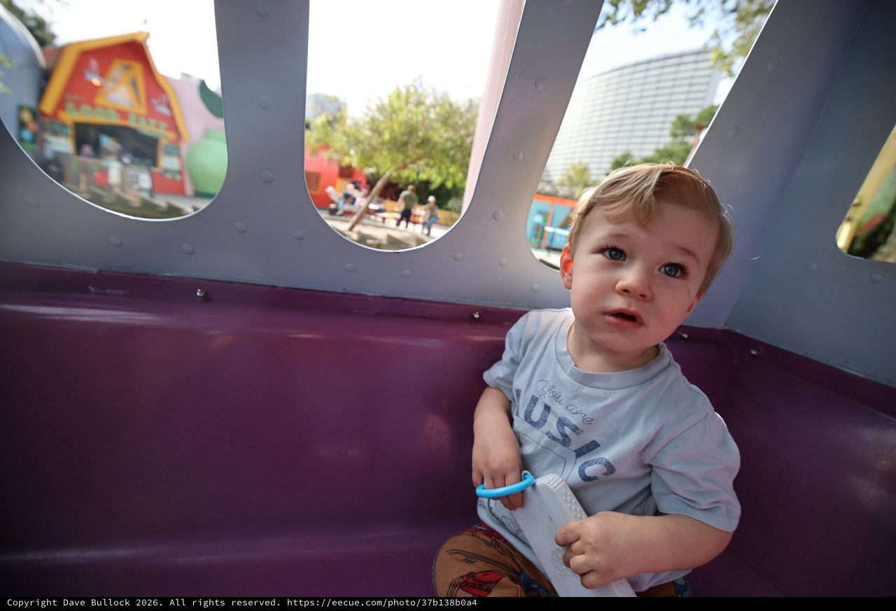 Toddler's Playful Moment at Theme Park Playground