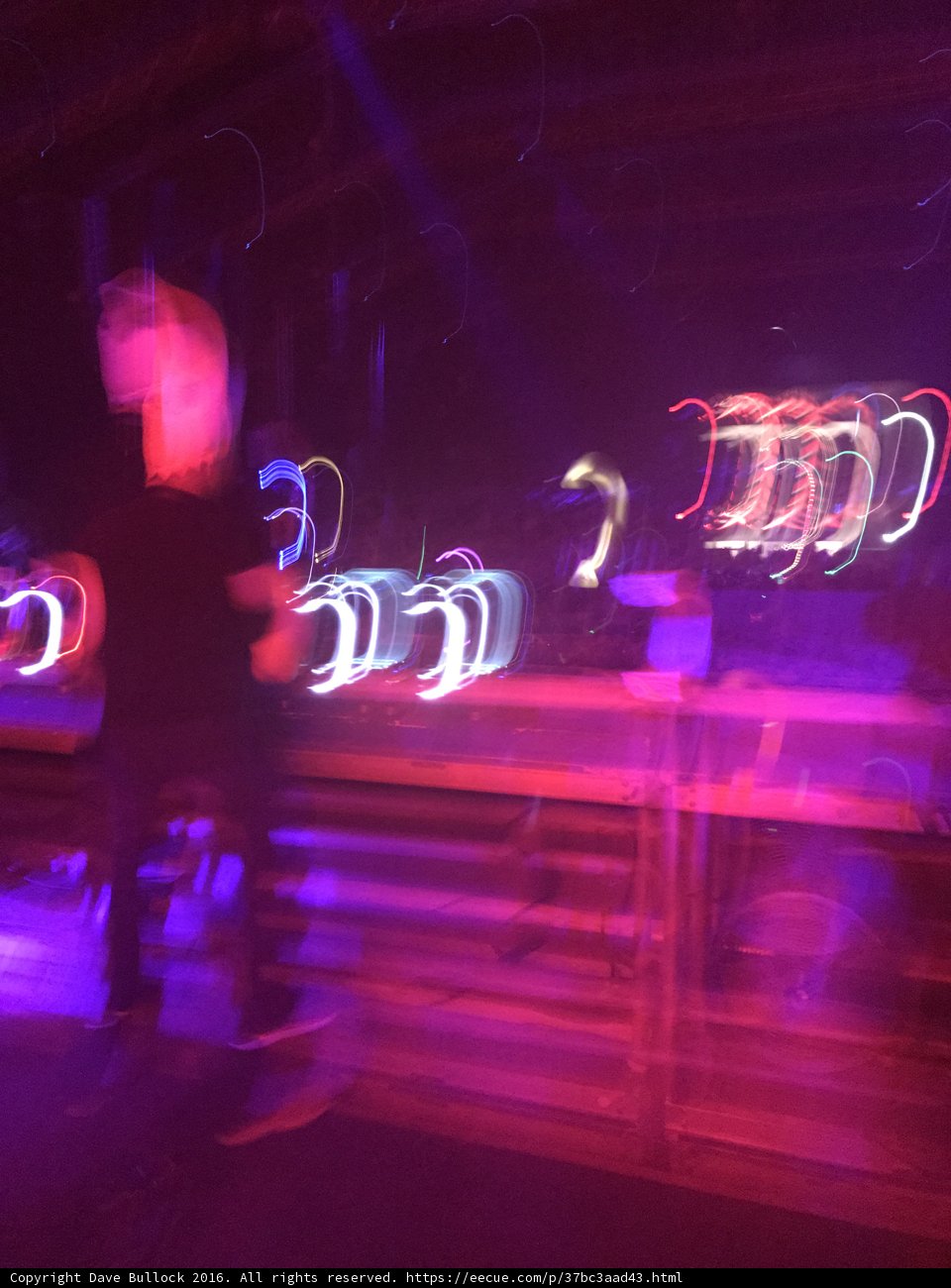 Blurred Man in Purple Lights