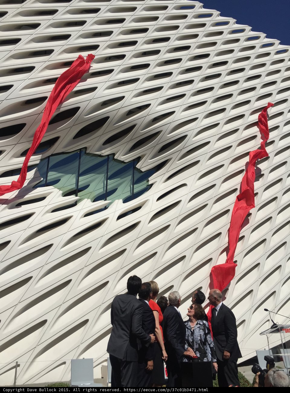 Group of People with Red Flags in Front of The Broad