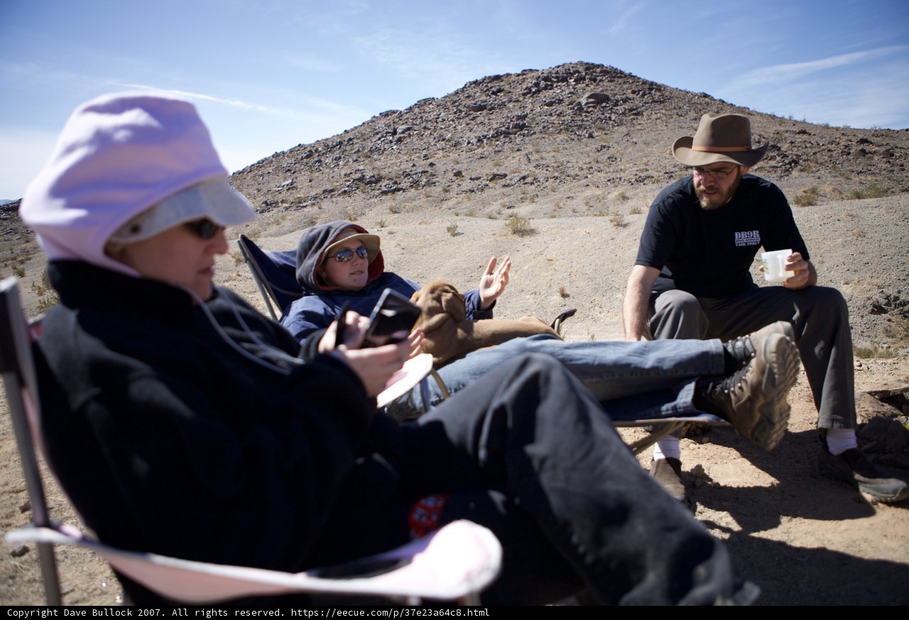 Outdoor Relaxation with Man, Woman, and Dog