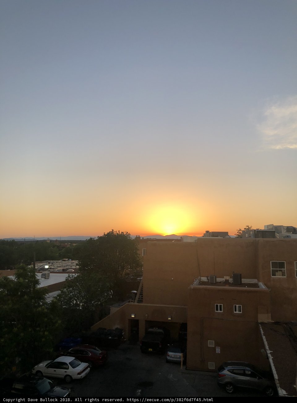 Sunset over a Parking Lot with 7 Cars