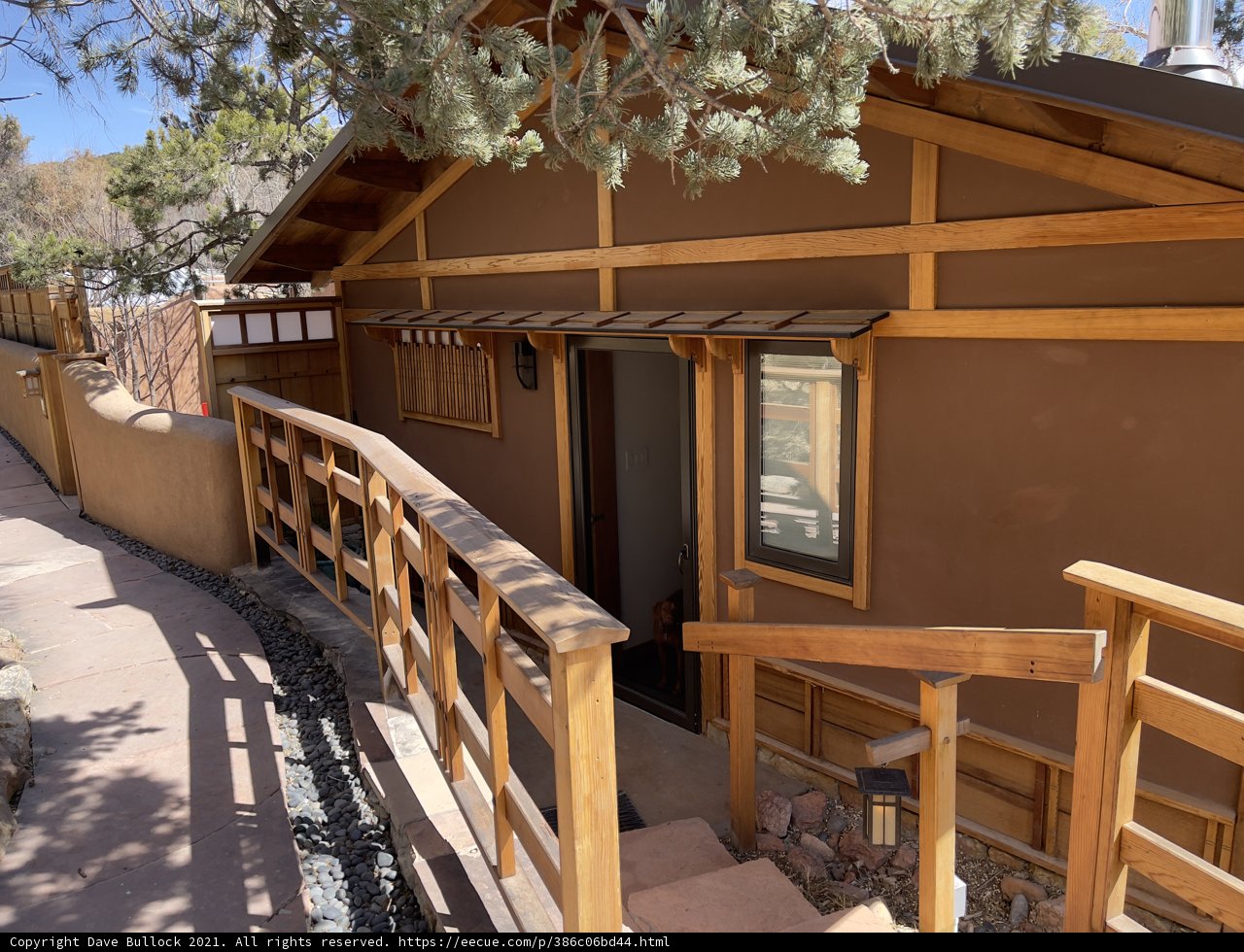 A Cozy House with a Wooden Railing