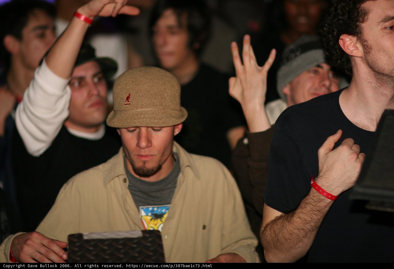 Hat-Wearing Man in a Nightclub