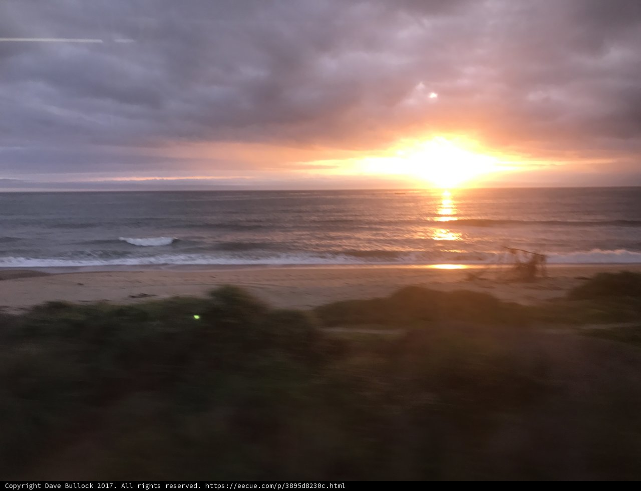 Train Window Sunset Over the Ocean