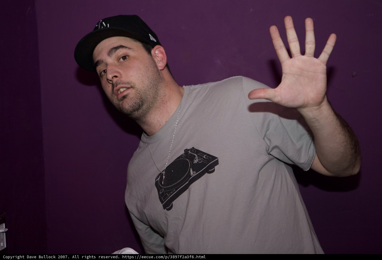 Grey-Shirted Man Rocks a Baseball Cap
