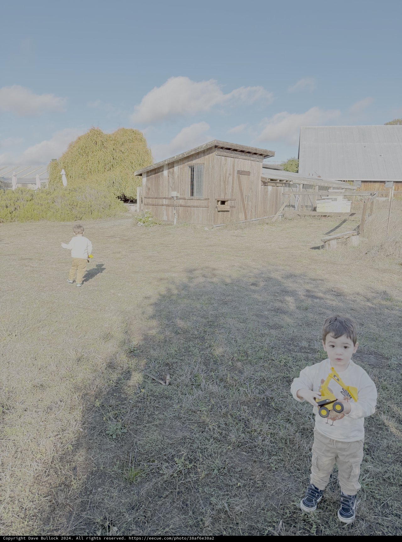 Child Playing at Rural Farm Setting