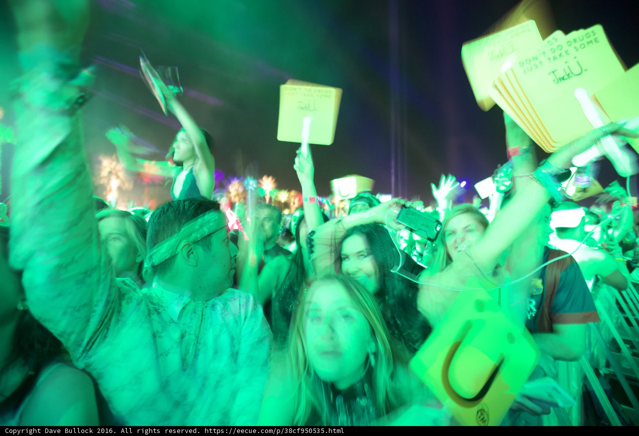 Guy Fieri Rocks the Crowd Caption: Celebrity chef Guy Fieri joins the fun as a boisterous crowd lights up the night with signs and enthusiasm at Coachella 2016.