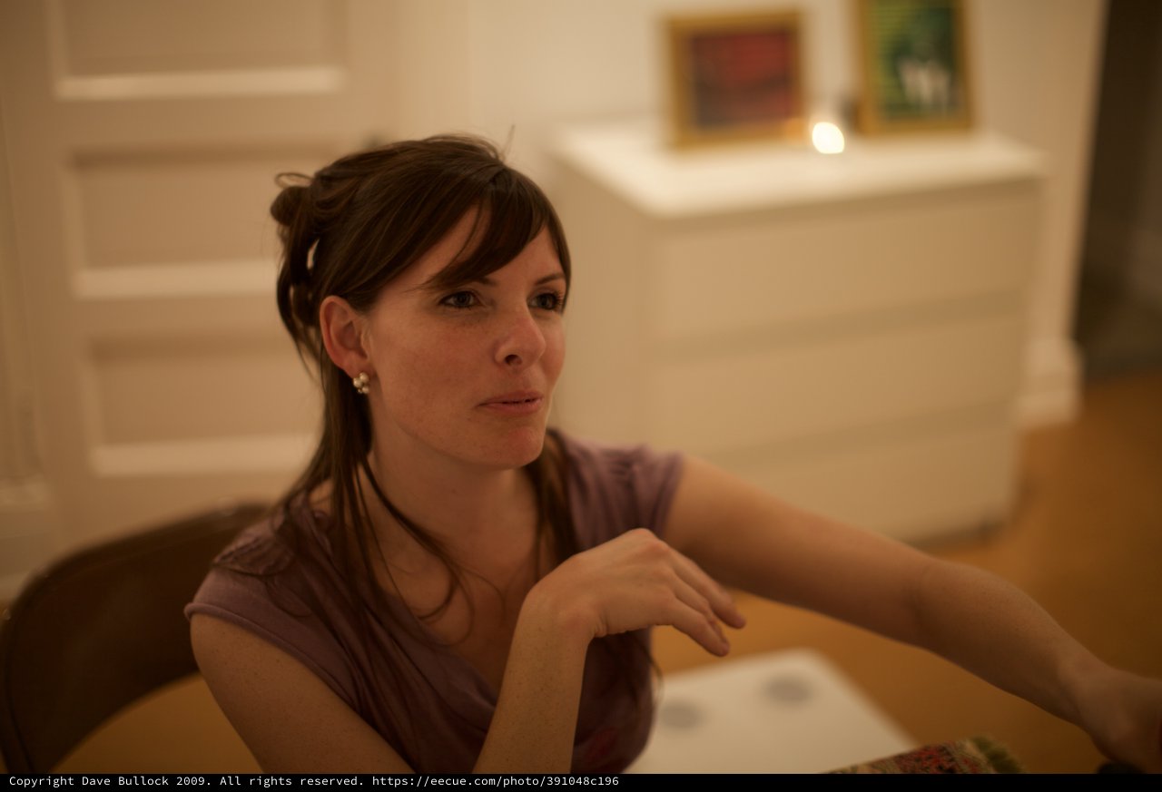 Thoughtful Woman at Art Gallery Evening Event