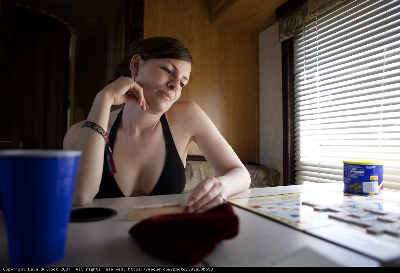 Contemplative Woman Playing Scrabble in RV