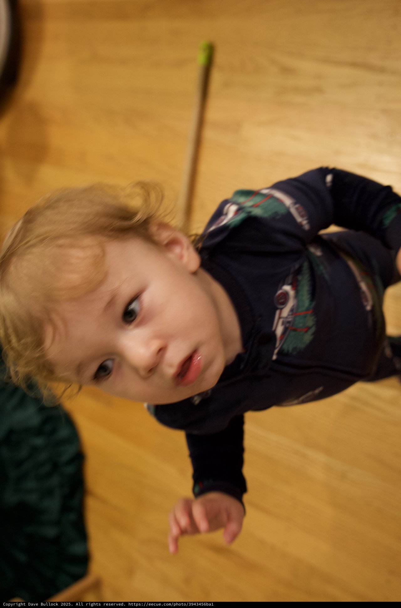 Child Lying on Wooden Floor - Christmas Morning Portrait