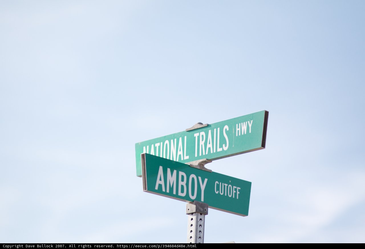 Two Road Signs in the Blue Sky