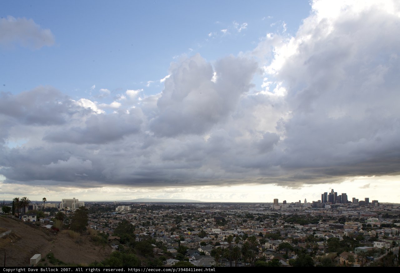 Majestic Cumulus Clouds Over Metropolis