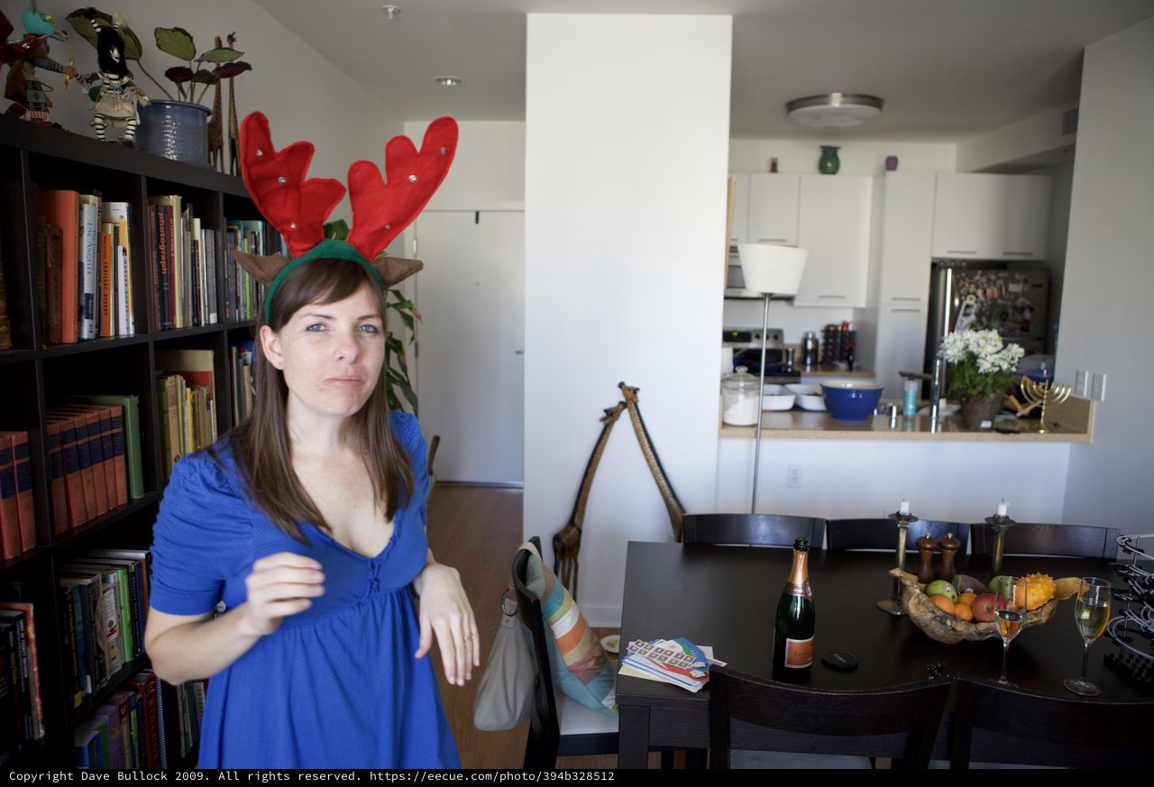 Unamused Woman in Reindeer Antlers on Christmas Day
