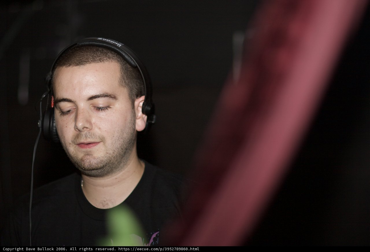 Man in Black Listening to Music