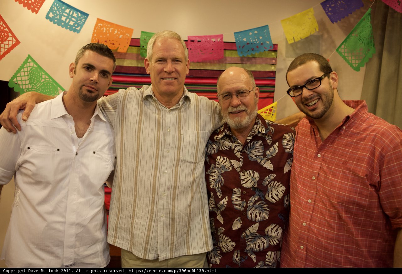 Three Men Proudly Display the Mexican Flag