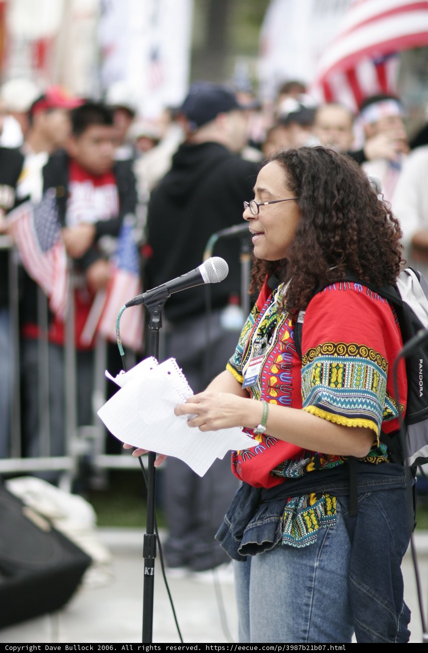 Woman with a Microphone Leading the Student Protest