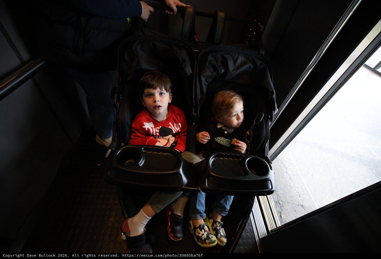 Two Children Riding Theme Park Dark Ride