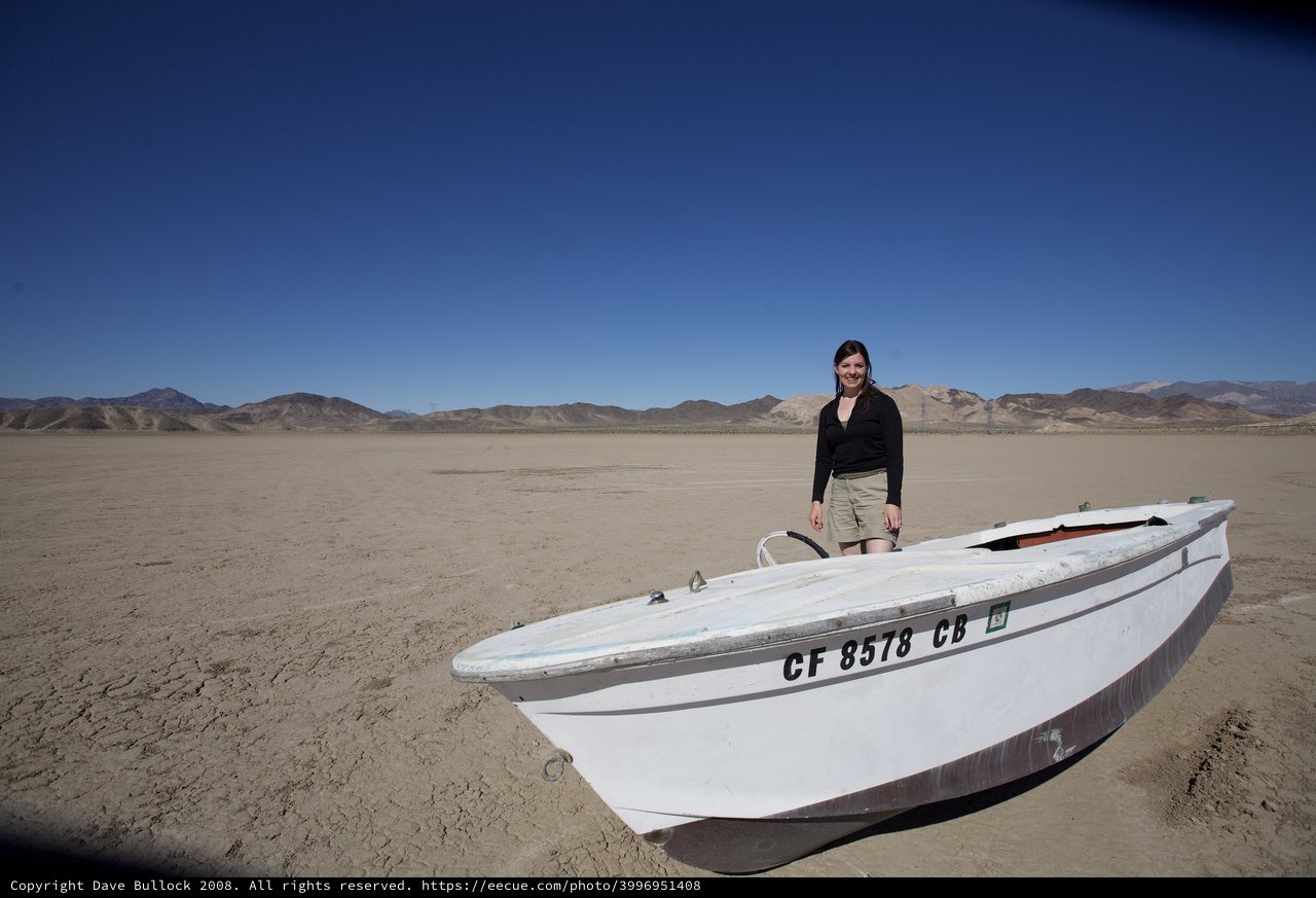 Stranded Boat on a Vast Dry Desert Lakebed