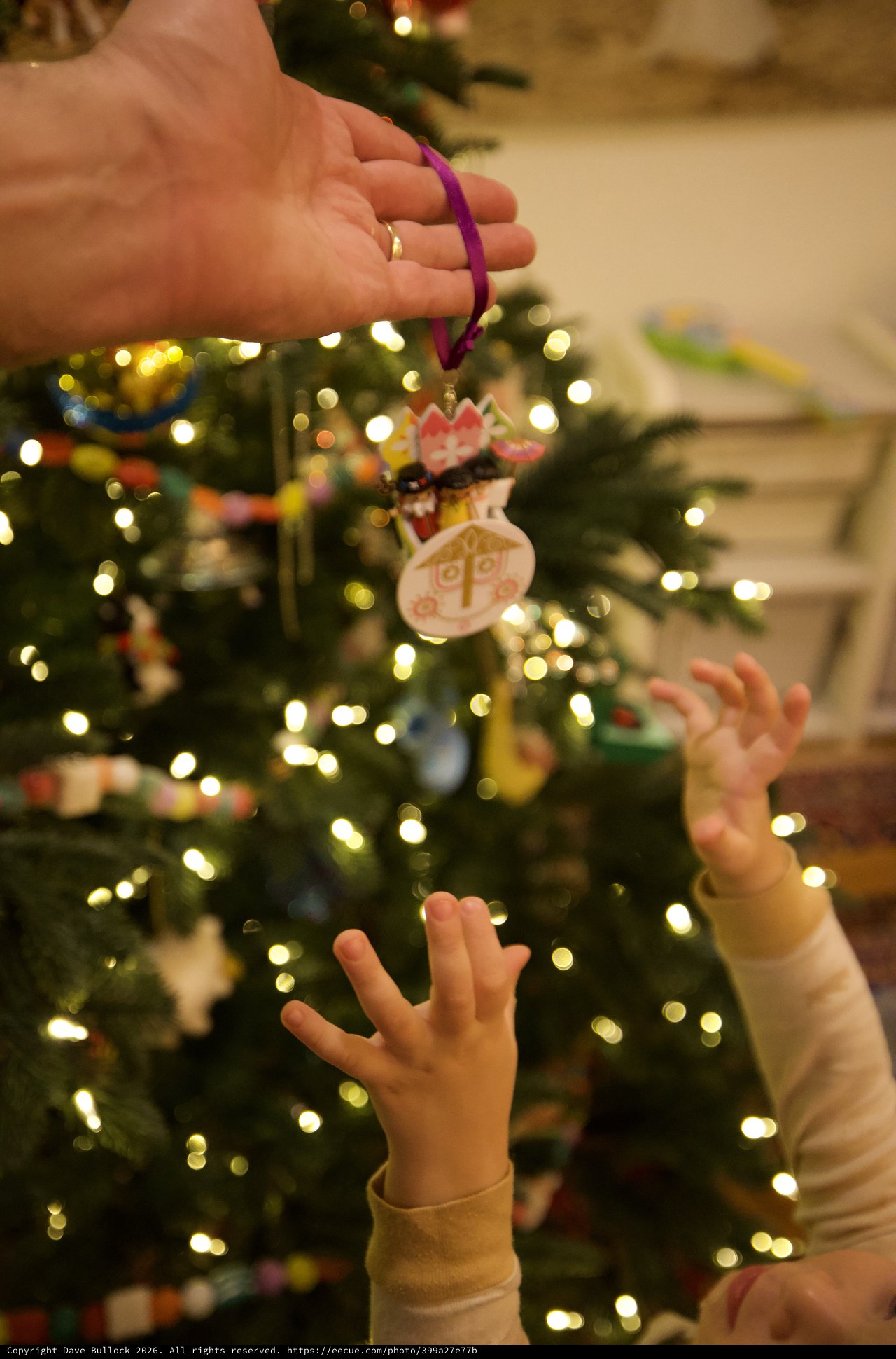Child Reaching for Handmade Christmas Ornament