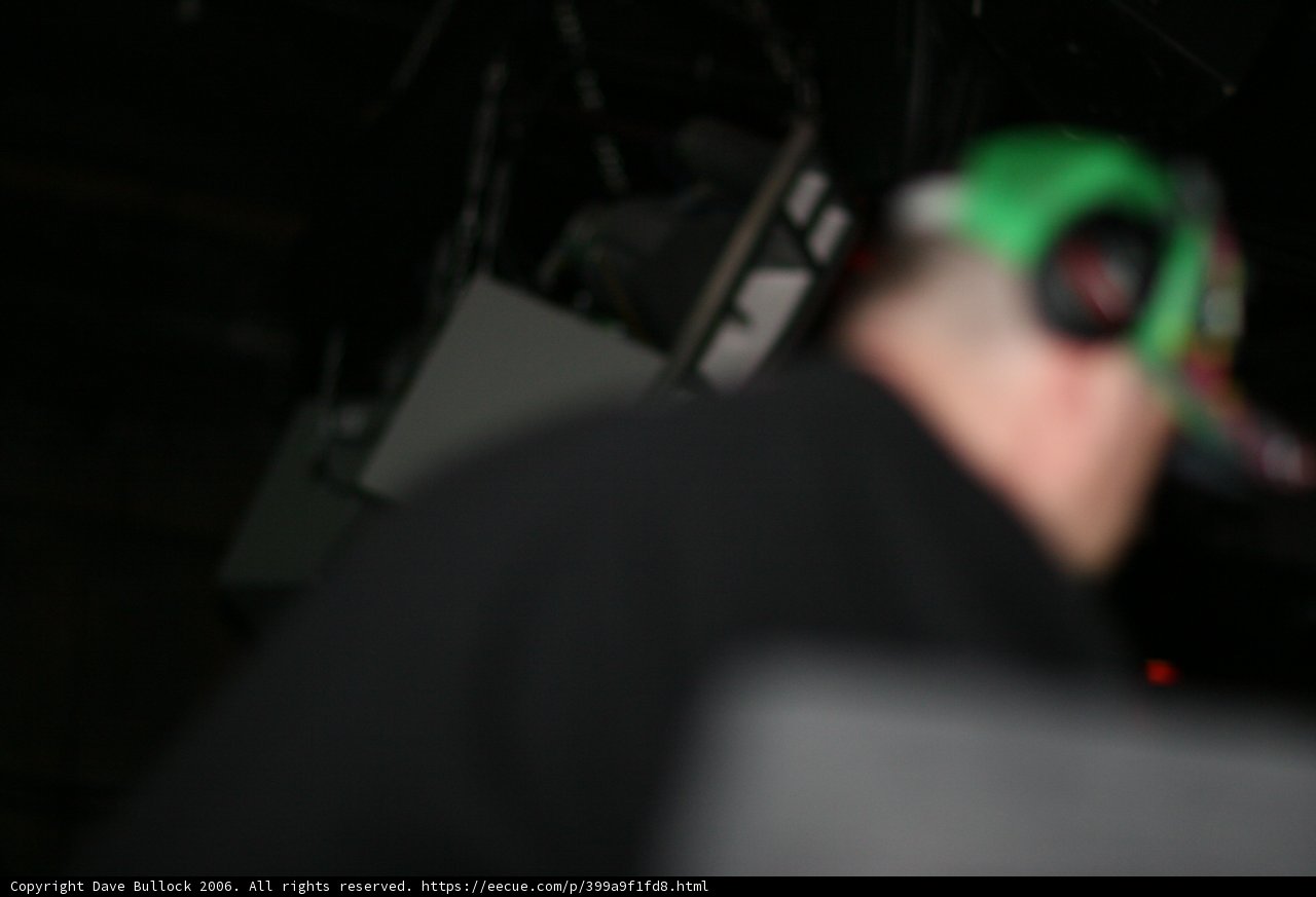 Green Hat and Headphones at the Shooting Range