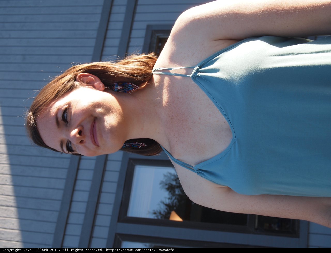 Young Woman in Teal Dress at Outdoor Event
