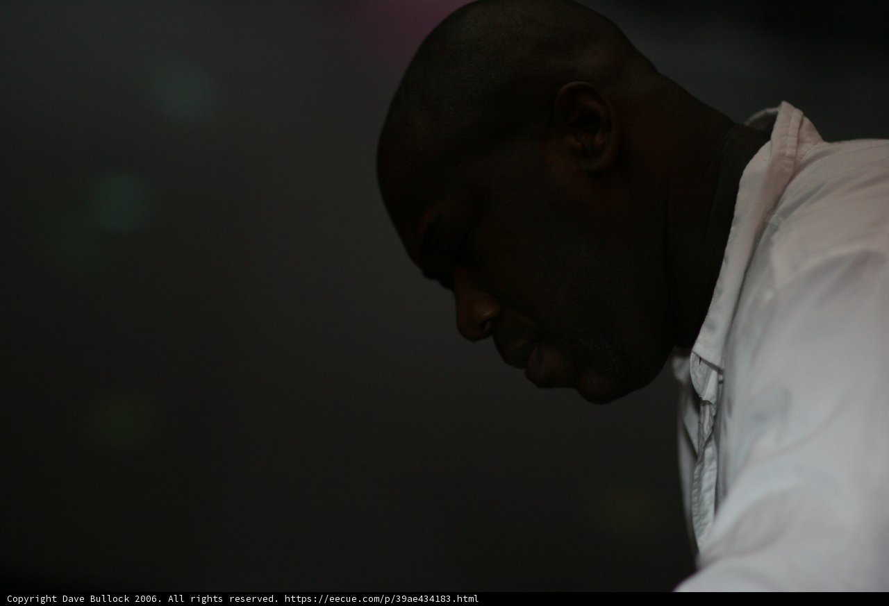 Contemplative Man in White Shirt
