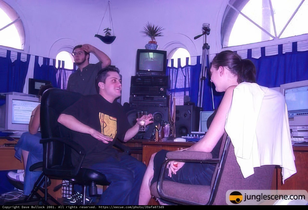 Man Sitting in Jungle of Technology
