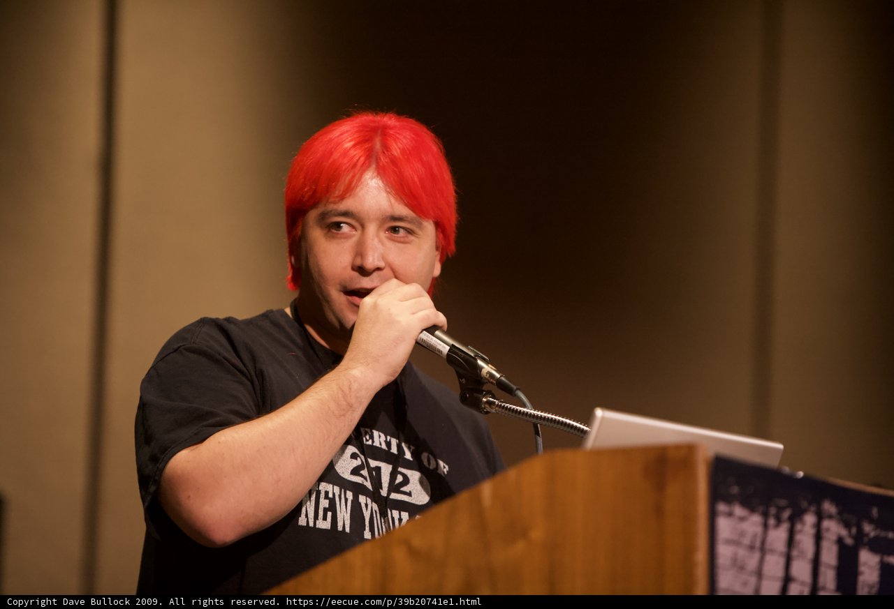 Red-Haired Speaker Addressing the Crowd