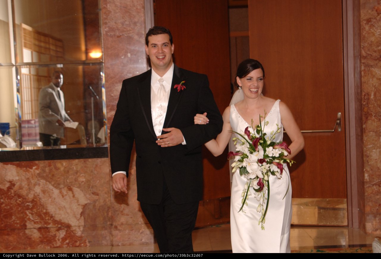 Newlyweds Radiate Joy Walking from Ceremony