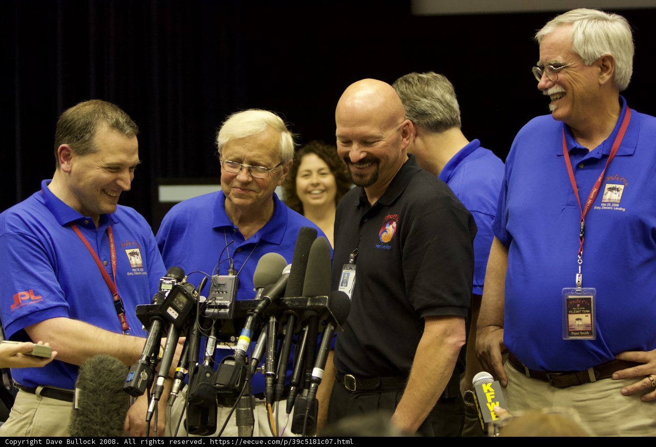 Men in Blue Shirts Address Crowd at Phoenix Press Conference