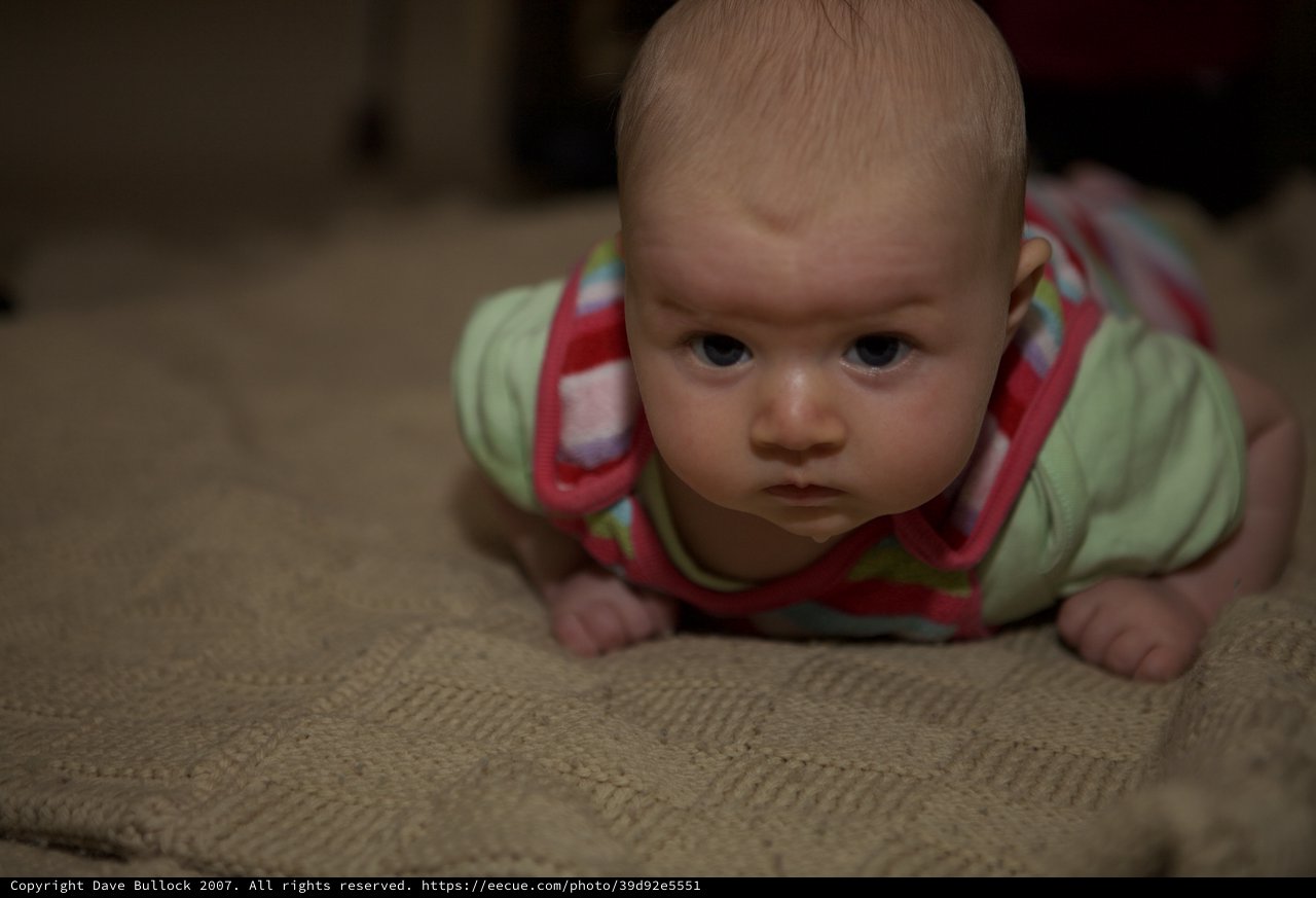 Determined Baby During Tummy Time on Carpet