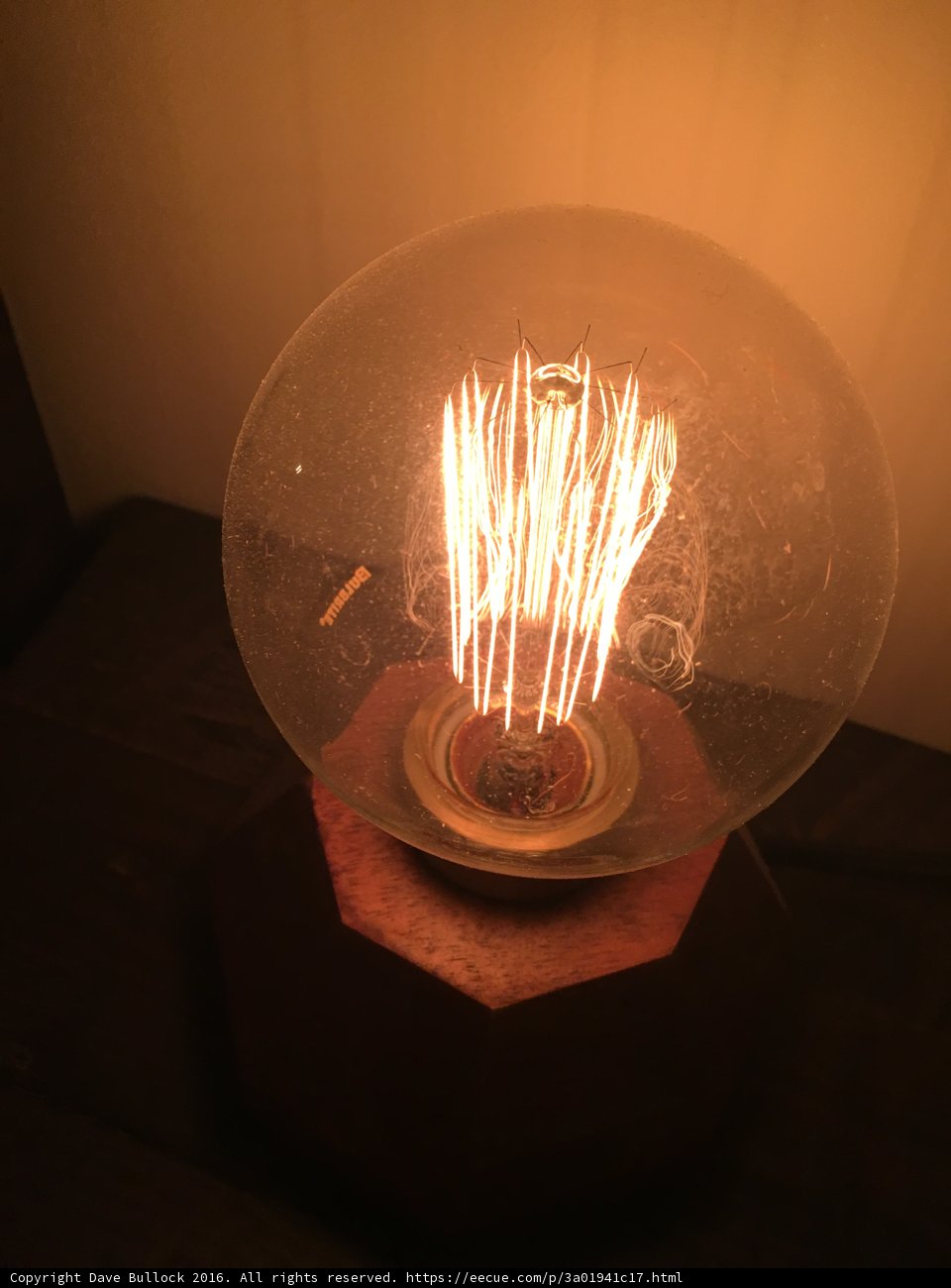Radiant Lightbulb on Wooden Stand