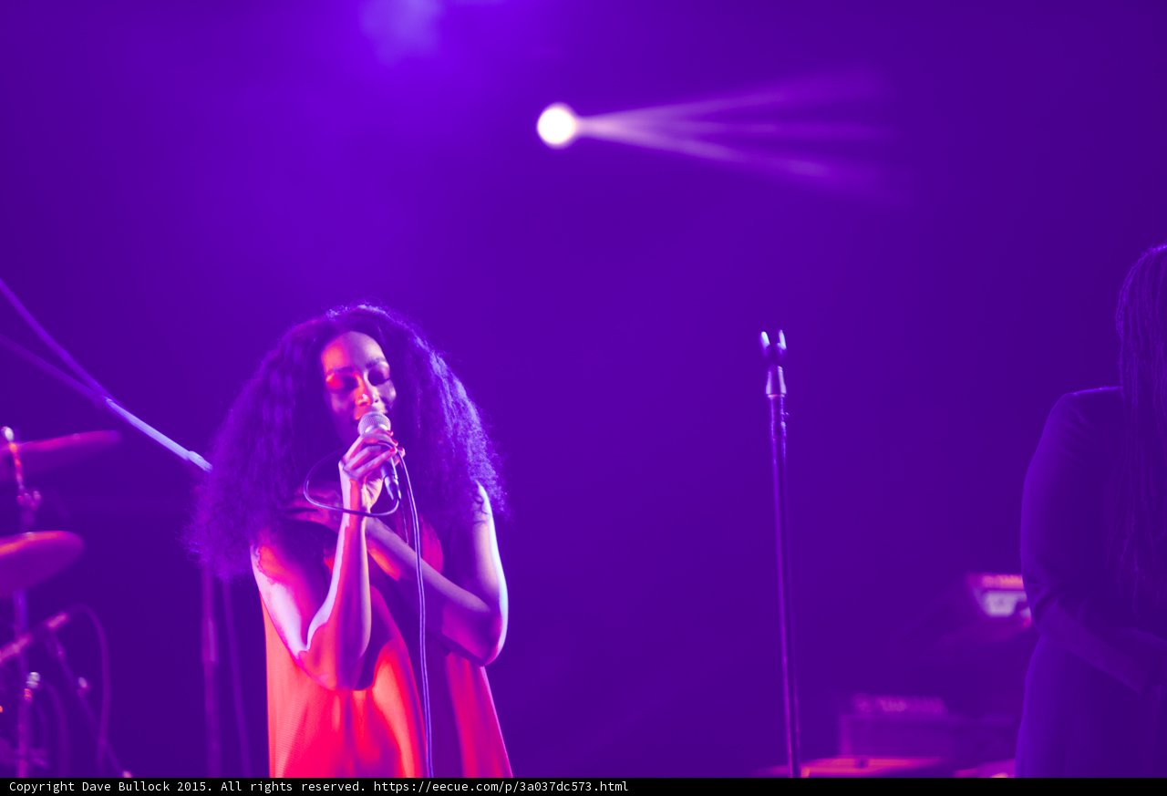 Solange Portrait Red Dress Singing Curly Hair Spotlight Purple Haze