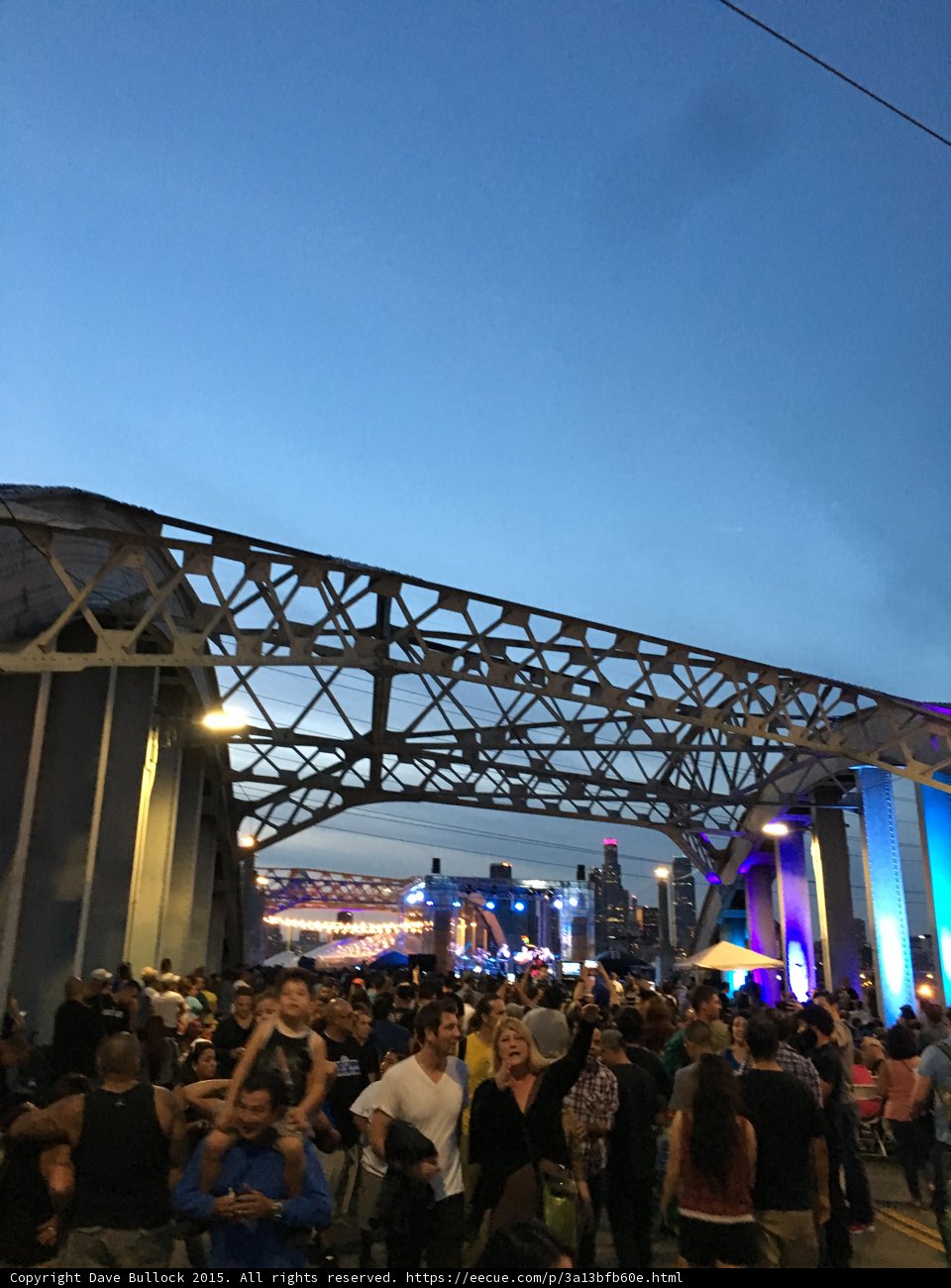 Dusk Crowd Under the Bridge