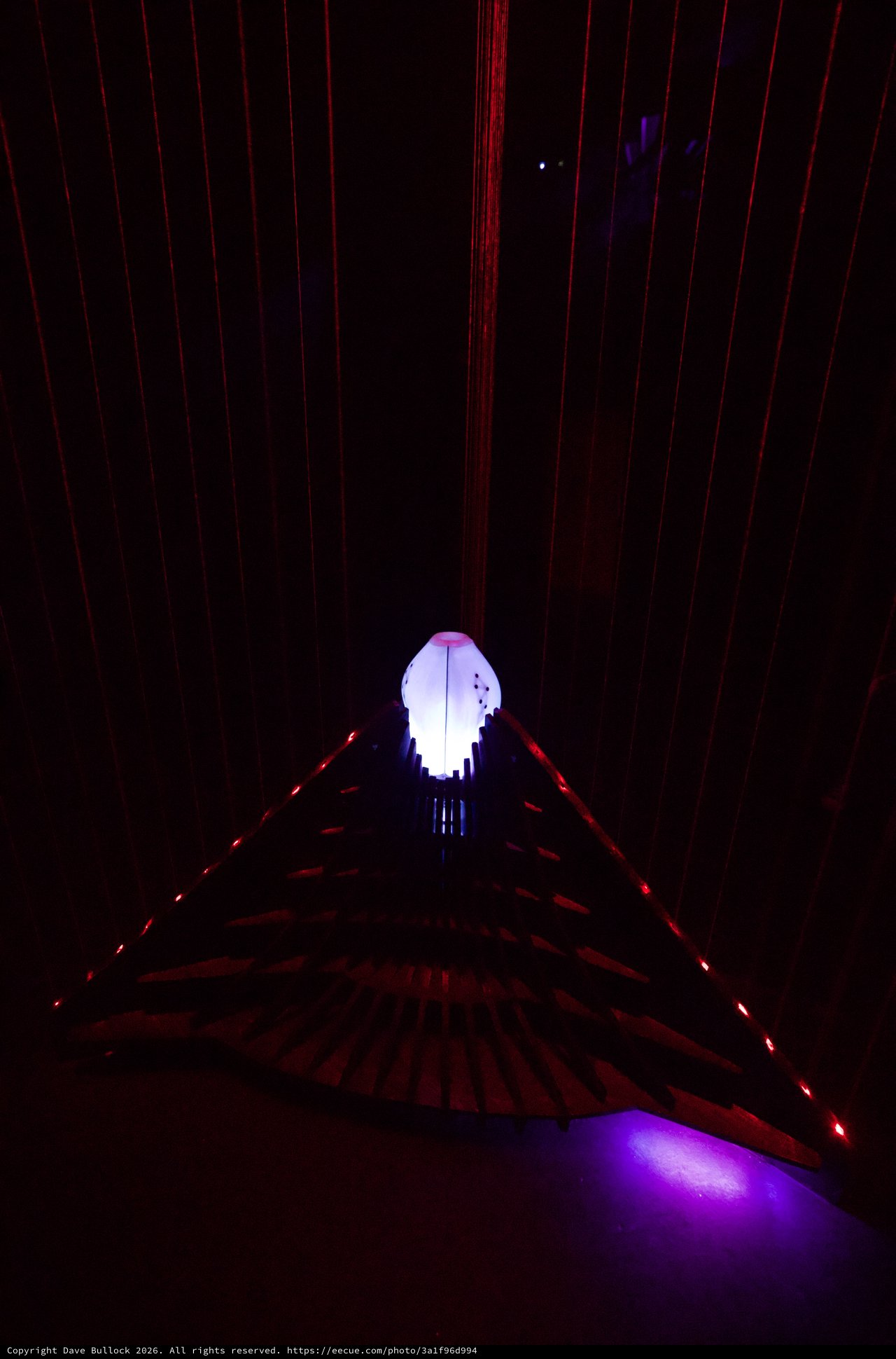 Illuminated Ghost Figure in Laser Light Installation