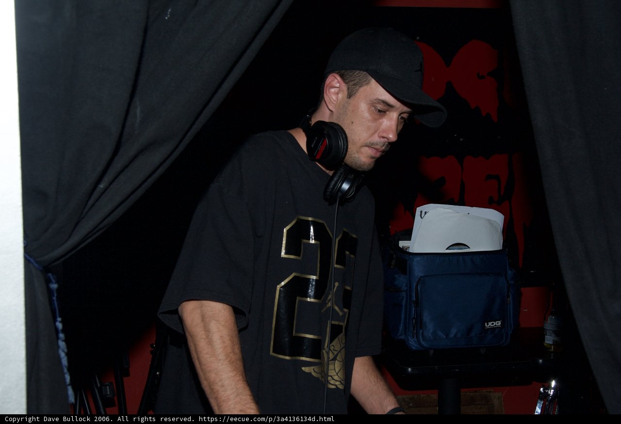 DJ S in Black Shirt and Baseball Cap