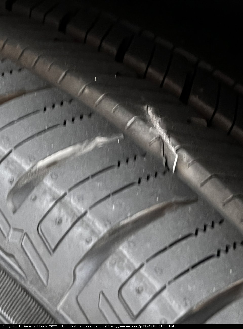 Dangerous Tire Crack Caption: A close up of a tire on a machine showcasing a dangerous crack that must be fixed immediately. #tire #wheel #car #vehicle #spoke #transportation #alloywheel #machinery