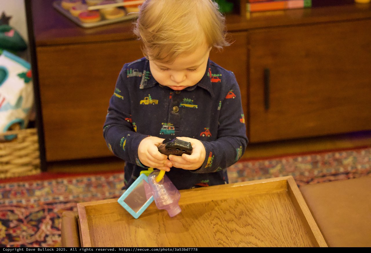 Toddler Playing with Toy Cars at Christmas Time